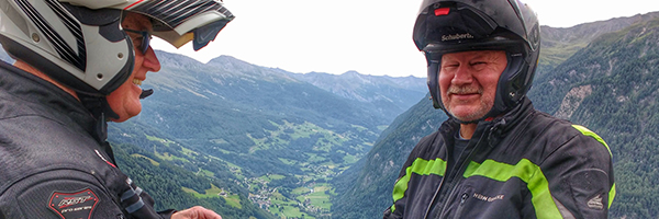 2 Friends discussing a Magellan Motorcycle Tour