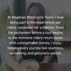 Charmaine from Magellan Motorcycle Tours smiling outdoors in riding gear during a motorcycle tour.